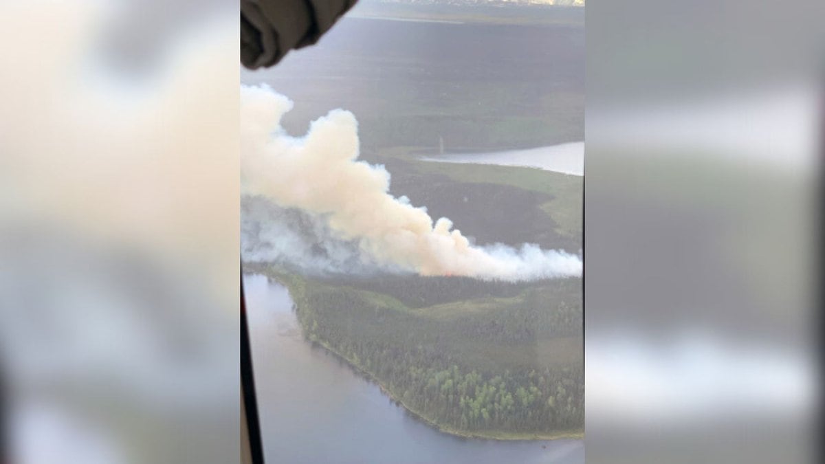 A photo taken by a pilot above the Loon Lake Fire burning about one-half mile southwest of Swan...