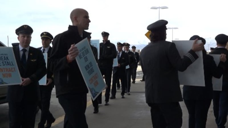 Alaska Airlines pilots picket outside the South Terminal