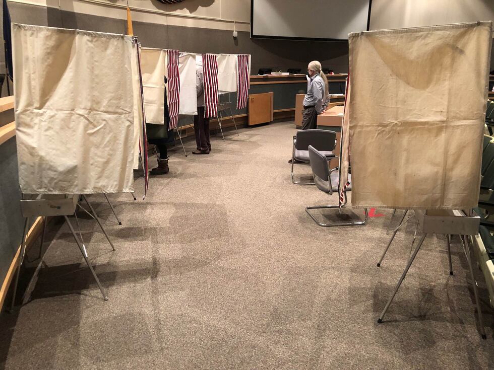 Voters get in early Tuesday to cast ballots at the Loussac Library in Anchorage.