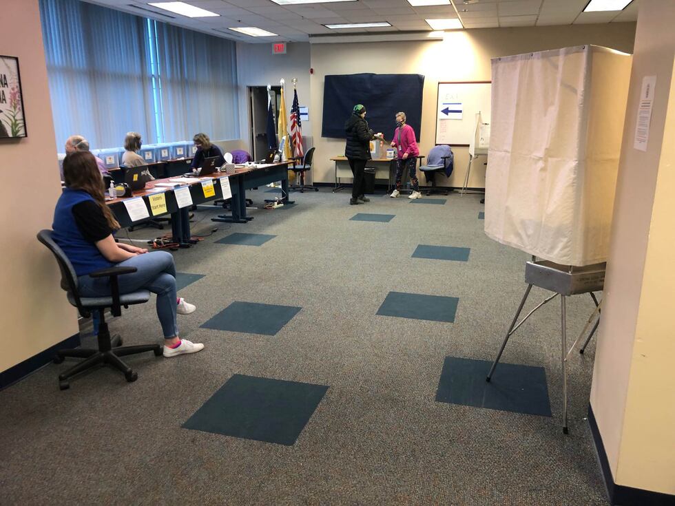 In-person voting began slowly Tuesday at Anchorage City Hall.