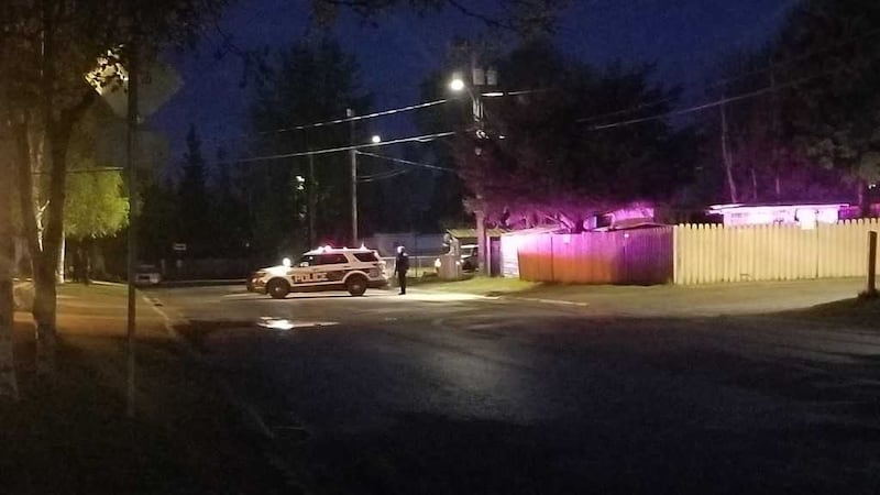 Police wait during a standoff between Evangelista and SWAT officers in May, 2019.
