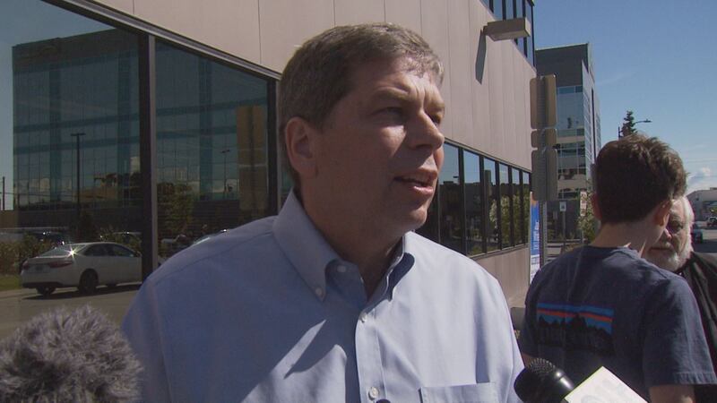 Former U.S. Senator Mark Begich speaks to reporters after filing paperwork to run for Governor...